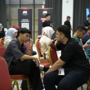 Two people engaged in conversation.